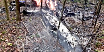 A picture of the wreckage atop the mountain in the wooded are near Elks Golf Course.