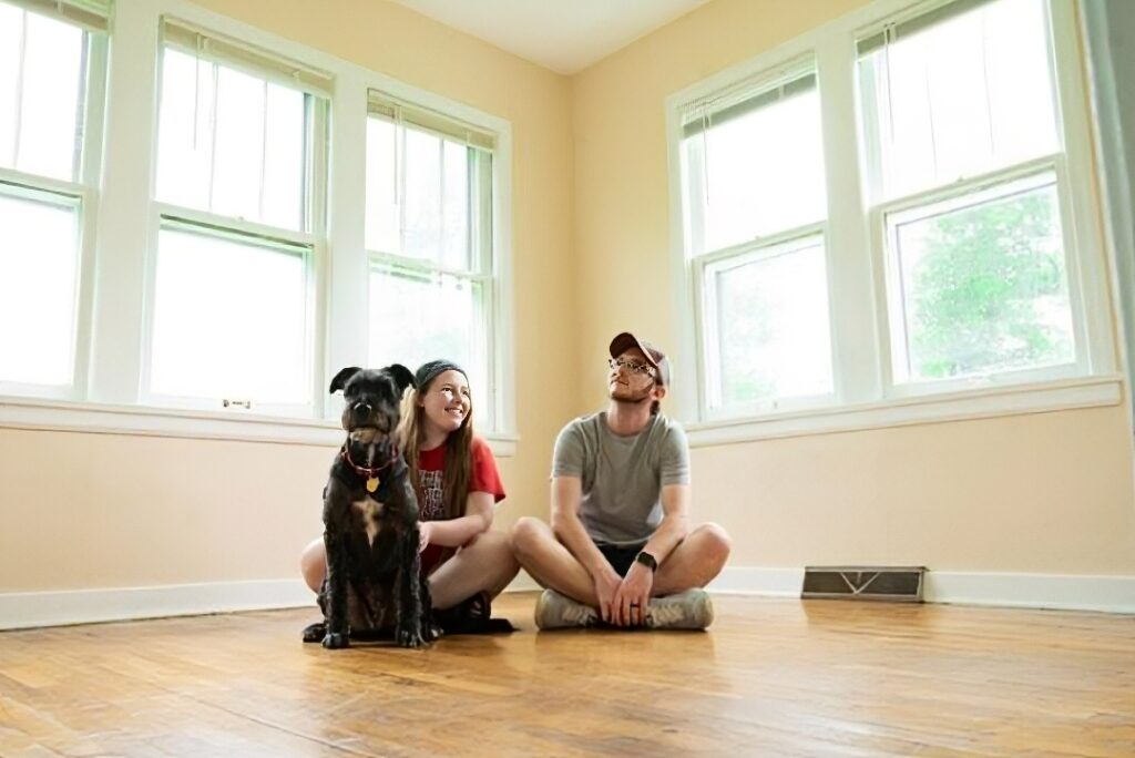 Family sitting in an empty home