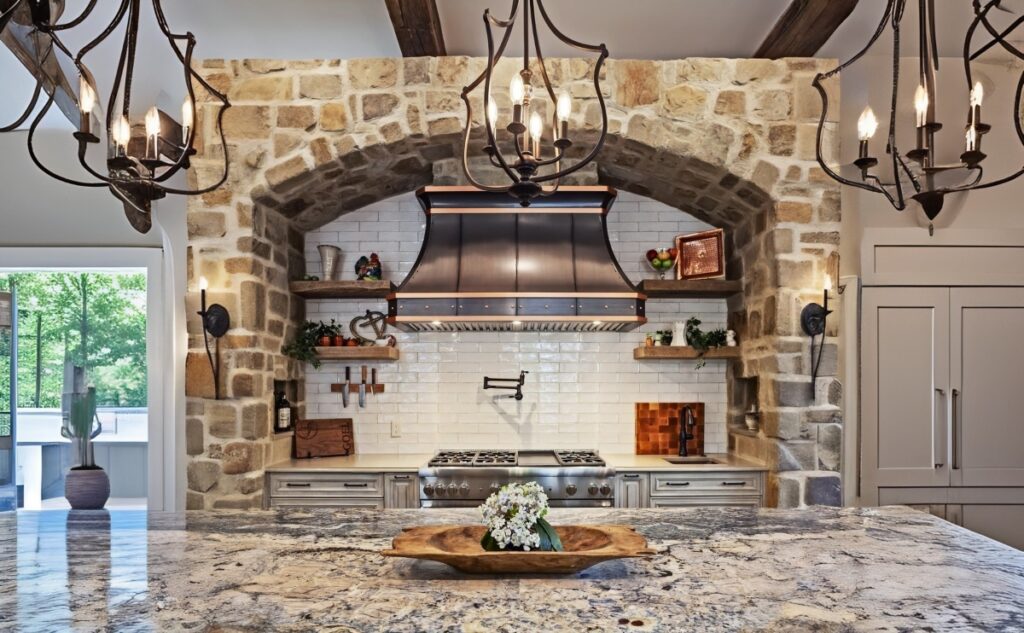 Brass range hood in warm, cozy kitchen
