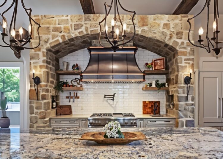 Brass range hood in warm, cozy kitchen