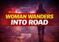 woman wanders into road