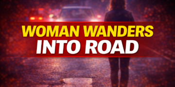 woman wanders into road