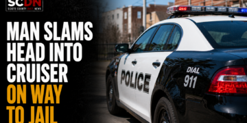 man slams head into cruiser