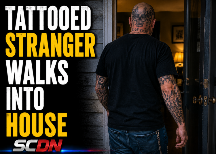 tattooed stranger walks in