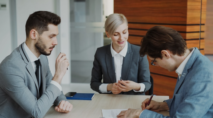 A lawyer reviewing documents with a client