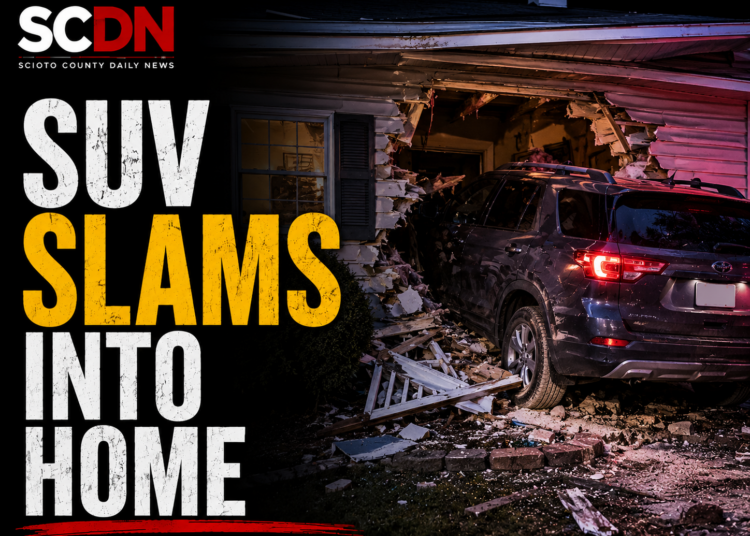SUV slams into house