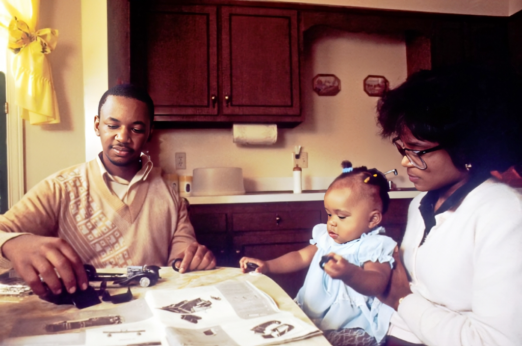 Two parents talking calmly across a kitchen table