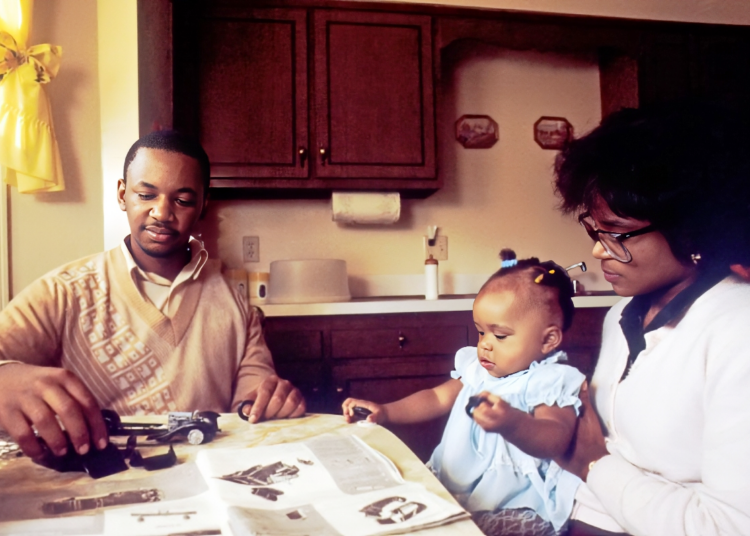 Two parents talking calmly across a kitchen table