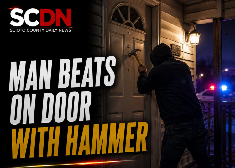 man beats on door with hammer