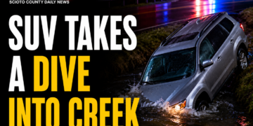 SUV takes dive into creek